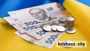 На фото: українські банкноти на державному прапорі, фото з відкритих джерел 